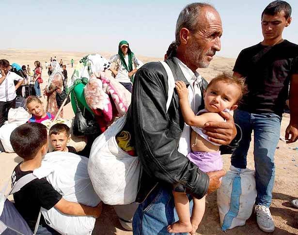 هولاند : لتهجير  المسيحيين وتوطين النازحين