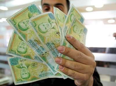 الليرة السورية تنهار ورامي مخلوف يتفرج