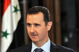 بالصور.. الأسد يزور جريح في الجيش بريف حمص