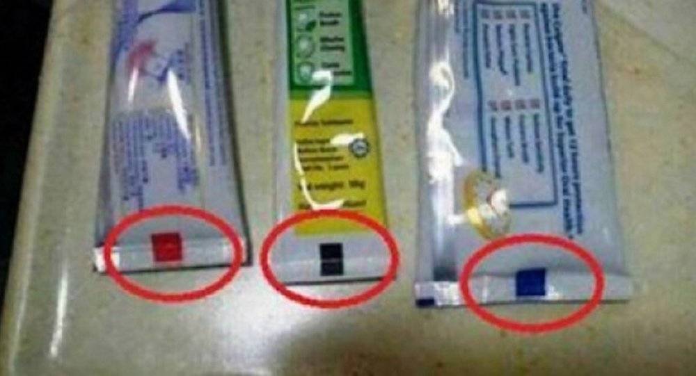 ماذا يعني اللون في أسفل أنبوب معجون الأسنان