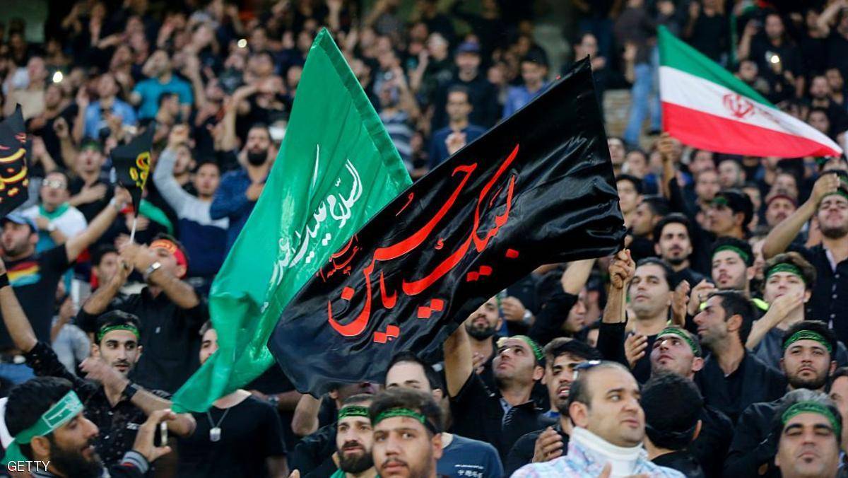 بالصور الفيفا يفرض عقوبات على إيران بسبب رفع رايات الحسين والعباس