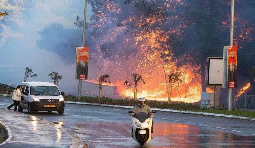 الطوارئ القصوى بحيفا وغلق مطار بن غوريون والحريق متواصل لليوم الرابع