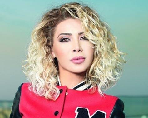 بالفيديو - نوال الزغبي تكشف للمرة الاولى سرّ غياب توأمها عن الإعلام.. وماذا قالت عن ابنتها؟