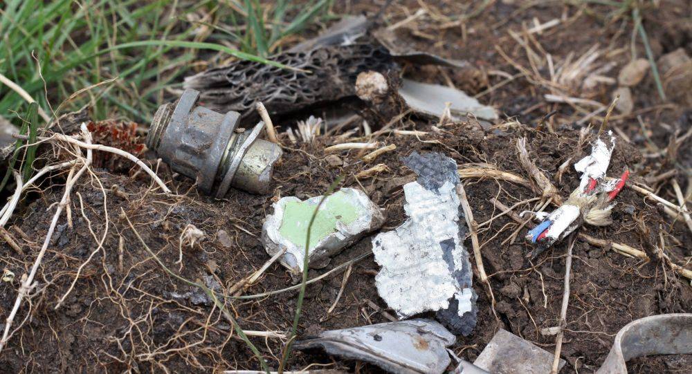 بالصور تحطم الطائرة التركية فوق منطقة سكنية