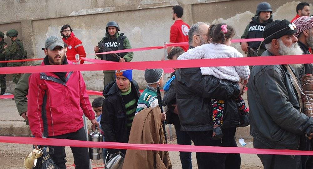 بدء خروج الدفعة الرابعة من المسلحين وبعض أفراد عائلاتهم من حي الوعر بحمص