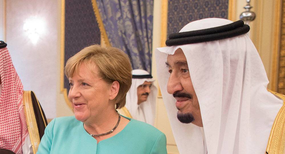 حقيقة تزييف صورة ميركل والعاهل السعودي