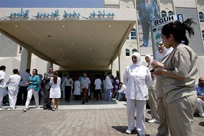 عاملون في مستشفى رفيق الحريري_ الجريمة علنية ومتمادية