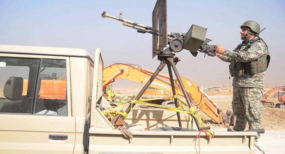 اندلاع اشتباكات بين الحشد الشعبي والبيشمركة في مناطق أخرى شمال بغداد