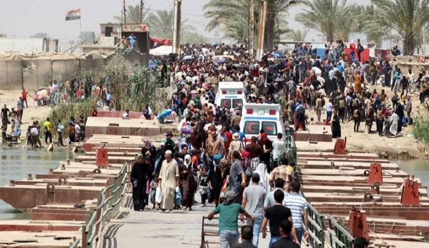اعادة 1072 أسرة نازحة عراقية الى مناطقها المحررة من داعش
