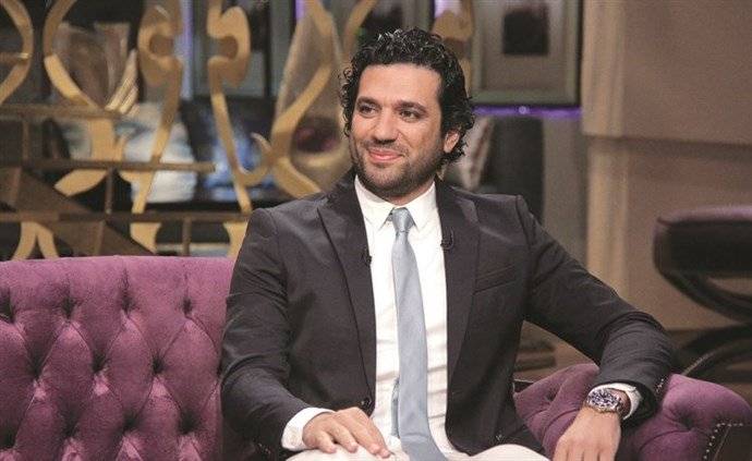الرداد وزوجته يثيران الجدل ببوستر «عزمي وأشجان»