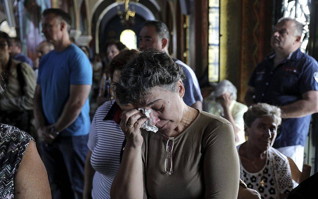 Death toll from Greek wildfire reaches 9,1 as village grieves