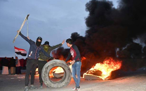 تجدد الصدامات وسط بغداد الرئيس العراقي يلتقي ترامب في دافوس