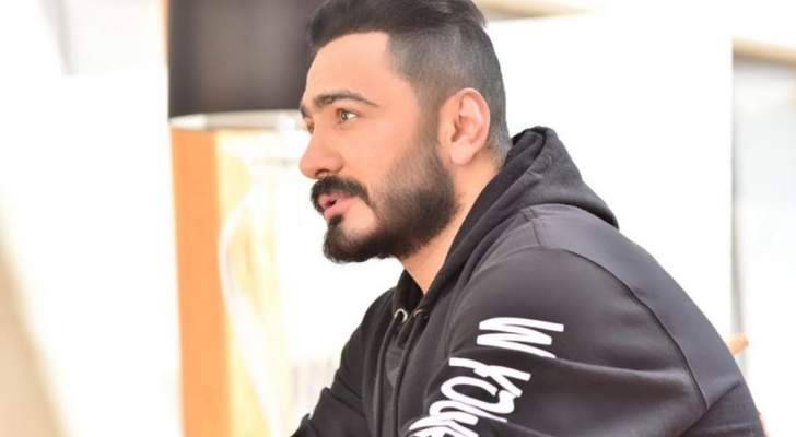 تامر حسني يكشف عن بوستر ألبومه الجديد-بالصورة