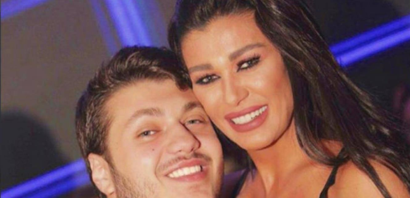نادين الراسي محجورة في منزلها.. وتقبل ابنها عبر الزجاج (صورة)
