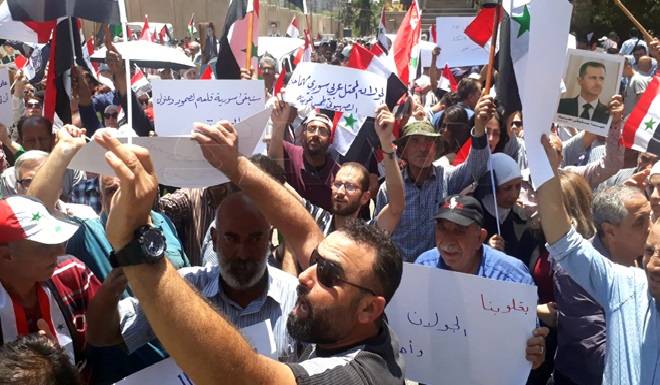 وقفة تضامنية مع أهالي الجولان المحتل أمام مقرّ الأمم المتحدة في دمشق