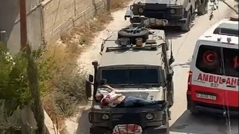 "فيديو صادم"... واشنطن: تقييد شاب فلسطيني بمقدمة سيارة عسكرية "إسرائيلية" غير مقبول على الإطلاق