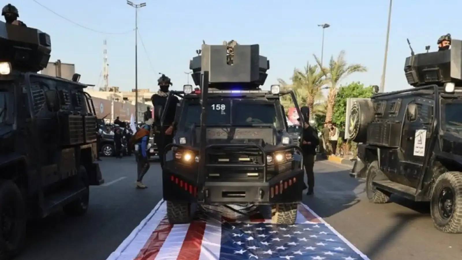 العراق يفتح تحقيقاً بتجاوز بحق العلم الأميركي خلال "يوم السيادة"