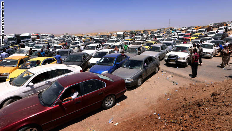 500 ألف عراقي يفرون من الموصل وداعش تناديهم "عودوا للمناطق المحررة"!