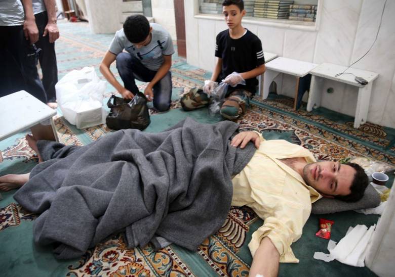 قتلى الكيماوي في الغوطة يعودون من الموت ويضحكون للحياة 