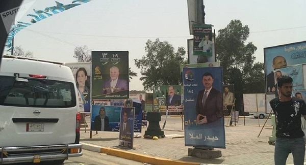 بالصور... الطفل قاتل أبيه المرشح للانتخابات العراقية استخدم صورة "ذباح داعش"