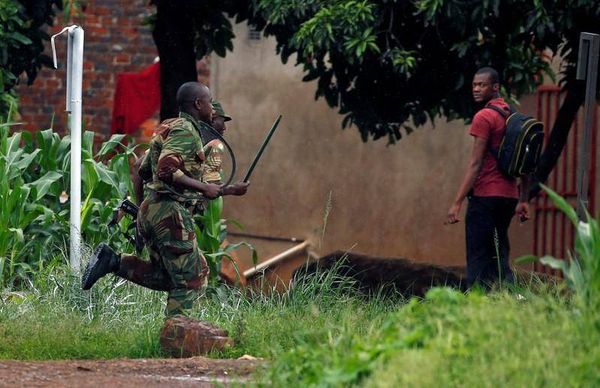 Zimbabwe army says "bogus" soldiers behind beatings