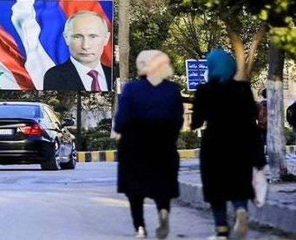 صور الرئيس بوتين في دمشق تنتشر اكثر من صور الرئيس السوري الرئيس الاسد